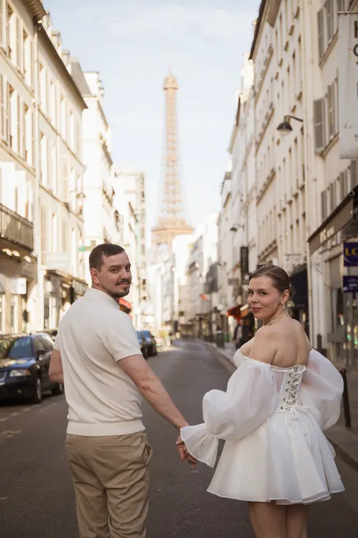 Photograph from the Couple — white dress, street session in Paris by Anna