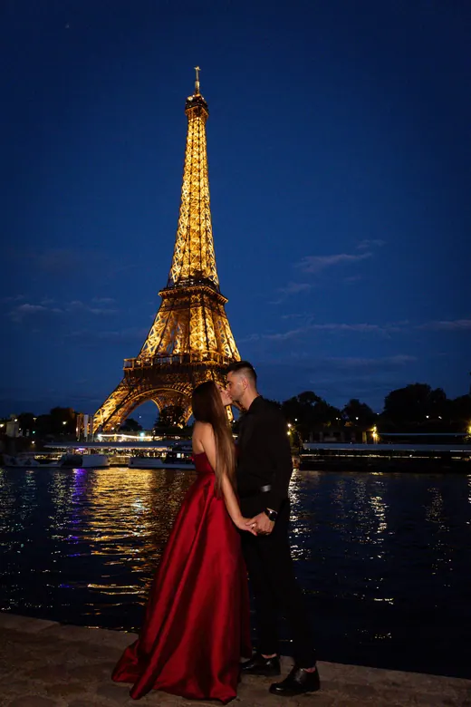 Photograph from the Couple — red dress at night session in Paris by Anna
