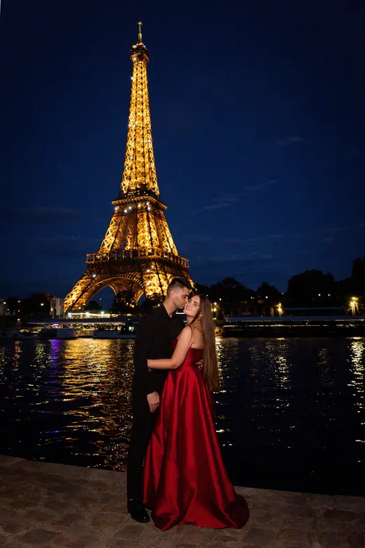 Photograph from the Couple — red dress at night session in Paris by Anna