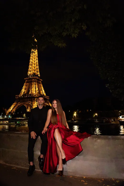 Photograph from the Couple — red dress at night session in Paris by Anna