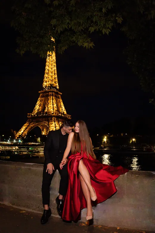 Photograph from the Couple — red dress at night session in Paris by Anna