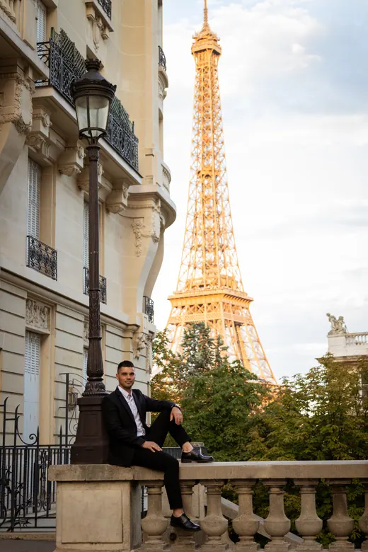 Photograph from the Couple — red dress at night session in Paris by Anna