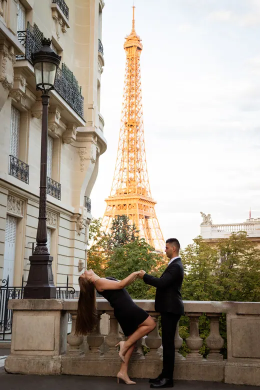 Photograph from the Couple — red dress at night session in Paris by Anna