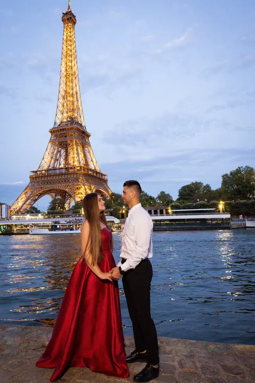 Photograph from the Couple — red dress at night session in Paris by Anna