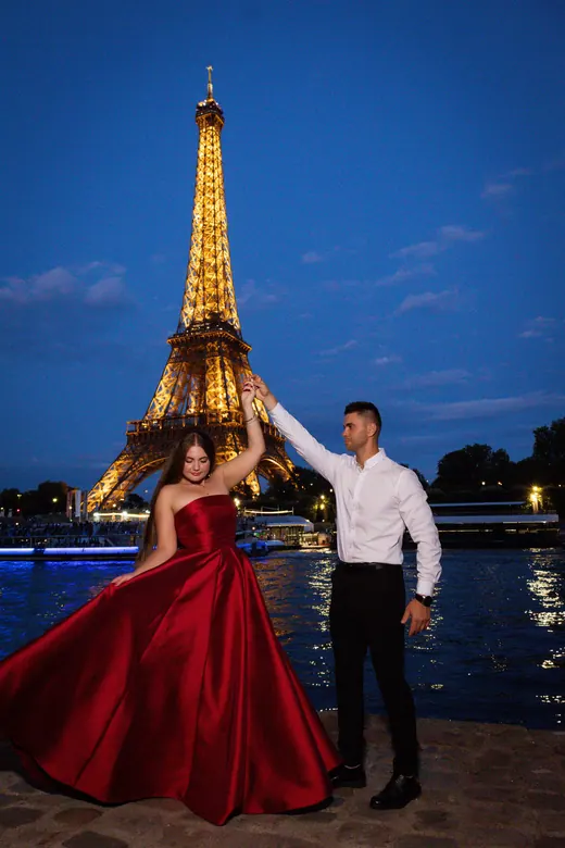 Photograph from the Couple — red dress at night session in Paris by Anna