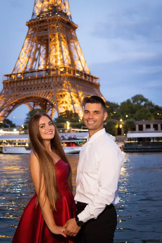 Photograph from the Couple — red dress at night session in Paris by Anna