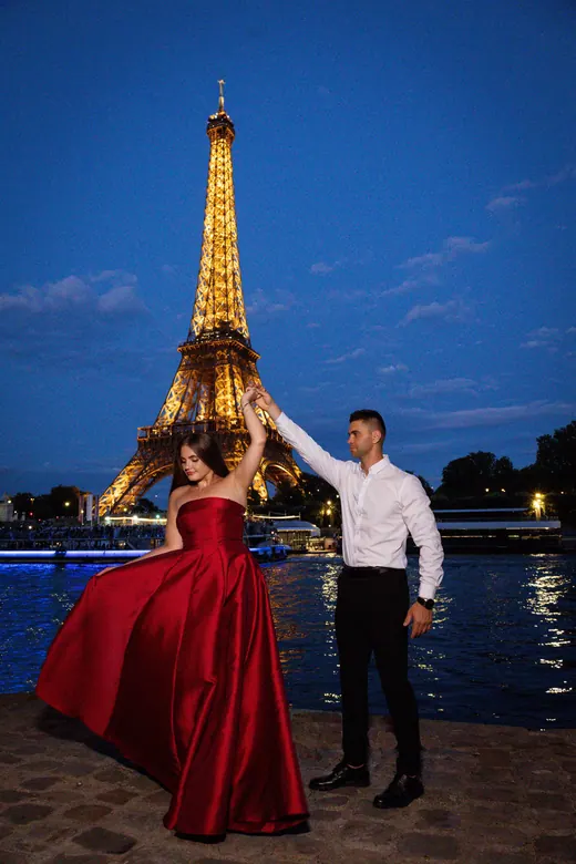 Photograph from the Couple — red dress at night session in Paris by Anna