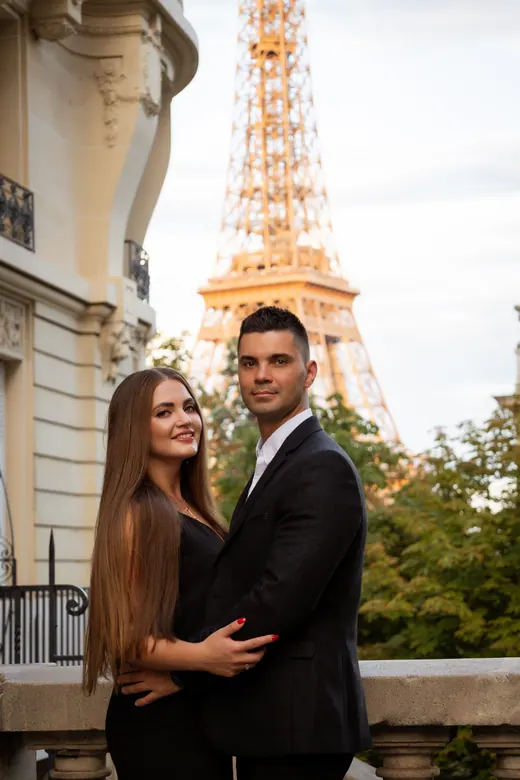 Photograph from the Couple — red dress at night session in Paris by Anna