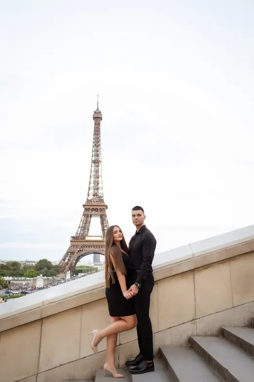 Photograph from the Couple — red dress at night session in Paris by Anna