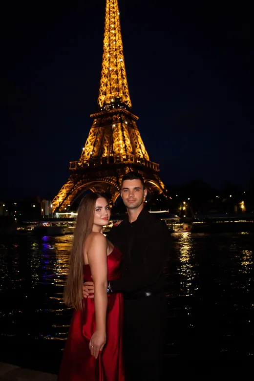 Photograph from the Couple — red dress at night session in Paris by Anna