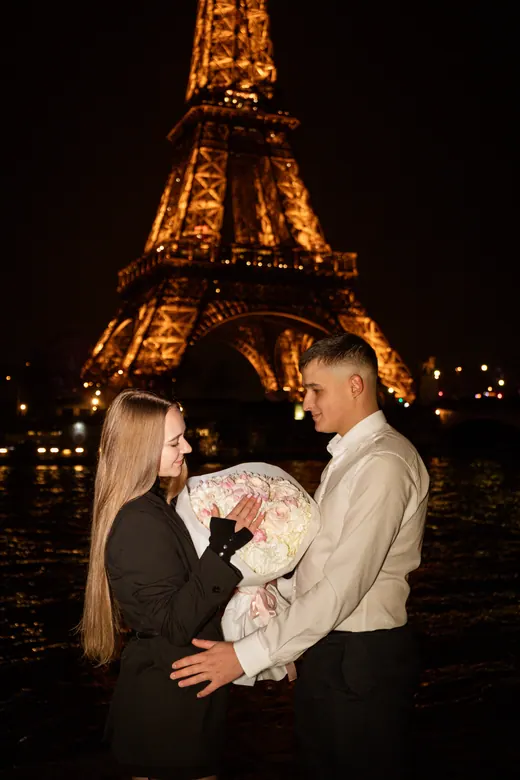 Photograph from the Proposal — white bouquet at night session in Paris by Anna